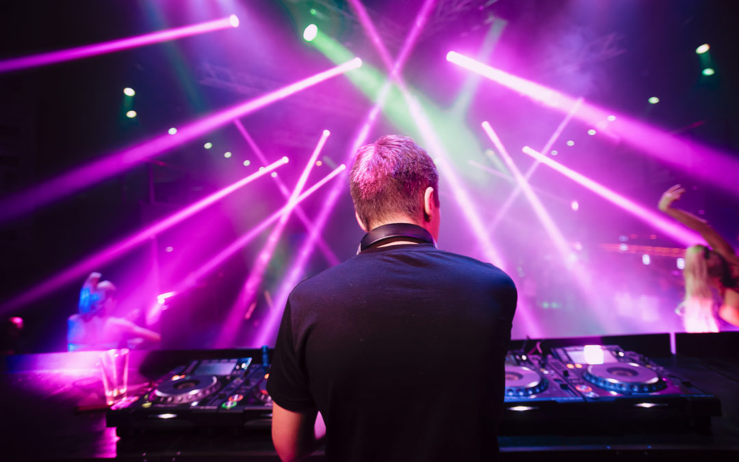 Dj,With,Headphones,At,Night,Club,Party,Under,The,Blue